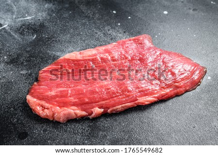 Raw flank steak. Marble beef black Angus. Black background. Top view ストックフォト © 