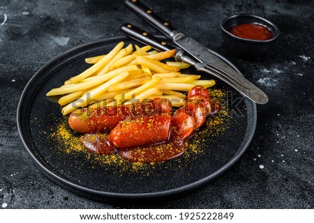 Foto Bild Würstchen mit Currysoße und Pommes Frites