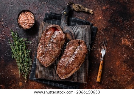 BBQ roasted Shoulder Top Blade cut or Australia wagyu oyster blade beef steak. Dark background. Top View 商業照片 © 