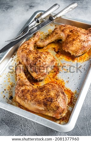 Oven Roasted barbeque chicken legs in baking dish. White background. Top view Stock fotó © 