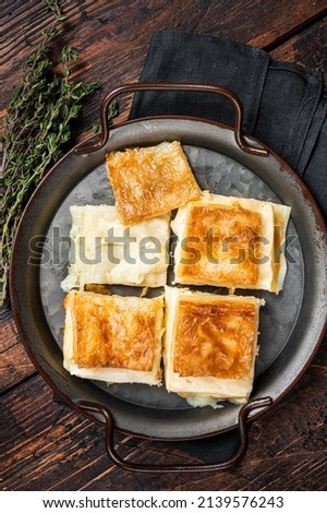 Turkish Su Boregi, Tabla borek or Adana Borek with cheese. Wooden background. Top view. Stok fotoğraf © 