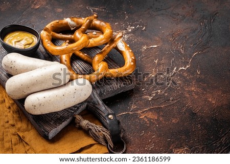 Similar – Image, Stock Photo German white sausage table top view. Bavarian veal sausage section