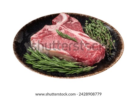 raw steak on black slate