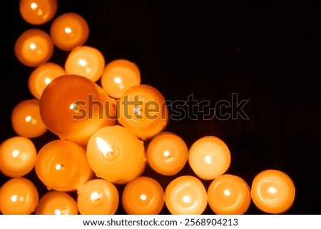 Similar – Image, Stock Photo One large candle and many small candles in a church