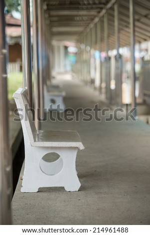 Chair white cement Laid to sit relax in the pathway.