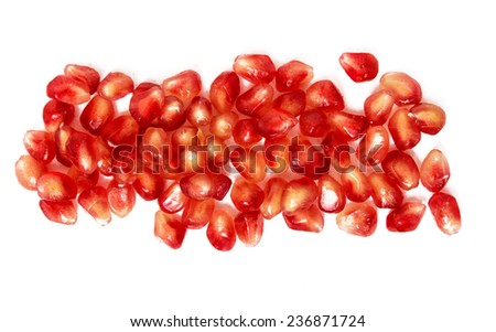 Pomegranate seeds on a white background