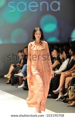 SINGAPORE - MAY 18: Model showcasing designs by Saena from Berlin at Audi Fashion Festival 2012 on May 18, 2012 in Singapore