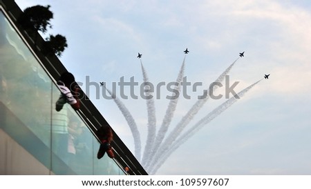 SINGAPORE - AUGUST 04: Republic of Singapore Air Force F-16 formation flypast during National Day Parade 2012 Preview on August 04, 2012 in Singapore