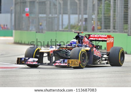 SINGAPORE - SEPTEMBER 22: Daniel Ricciardo racing in his Toro Rosso car during 2012 Formula 1 Singtel Singapore Grand Prix on September 22, 2012 in Singapore
