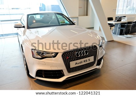 SINGAPORE - DECEMBER 15: White Audi RS5 sports coupe on display at the opening of the new Audi Centre Singapore December 15, 2012 in Singapore