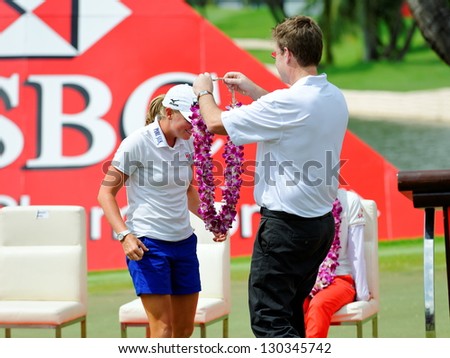 SINGAPORE - MARCH 3: American Stacy Lewis receiving a flower ring as she won the HSBC Women\'s Champions at Sentosa Golf Club Serapong Course March 3, 2013 in Singapore