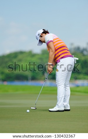 SINGAPORE - MARCH 2: Korean Jiyai Shin putting at the green during HSBC Women\'s Champions at Sentosa Golf Club Serapong Course March 2, 2013 in Singapore