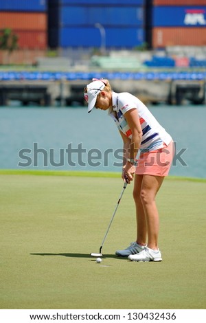 SINGAPORE - MARCH 2: American Paula Creamer putting at the green during HSBC Women\'s Champions at Sentosa Golf Club Serapong Course March 2, 2013 in Singapore