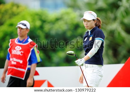 SINGAPORE - MARCH 3: Korean Sun Young Yoo watched her ball landing during HSBC Women's Champions at Sentosa Golf Club Serapong Course March 3, 2013 in Singapore