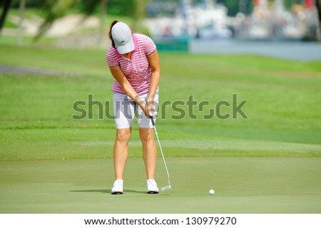 SINGAPORE - MARCH 3: Karine Icher putting at the green during HSBC Women\'s Champions at Sentosa Golf Club Serapong Course March 3, 2013 in Singapore