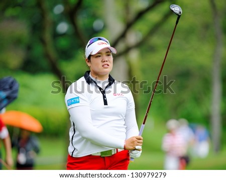 SINGAPORE - MARCH 3: Ariya Jutanugarn from Thailand watched her ball landing during HSBC Women\'s Champions at Sentosa Golf Club Serapong Course March 3, 2013 in Singapore