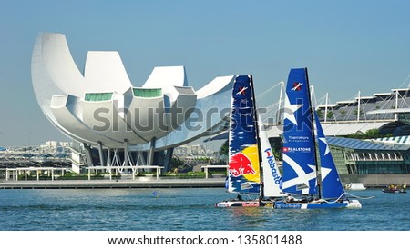 SINGAPORE - APRIL 13: Realteam racing Red Bull Sailing Team at the Extreme Sailing Series race at Marina Bay Reservoir April 13, 2013 in Singapore