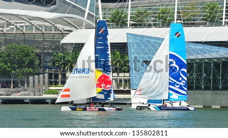 SINGAPORE - APRIL 13: Red Bull Sailing team racing The Wave, Muscat at the Extreme Sailing Series race at Marina Bay Reservoir April 13, 2013 in Singapore
