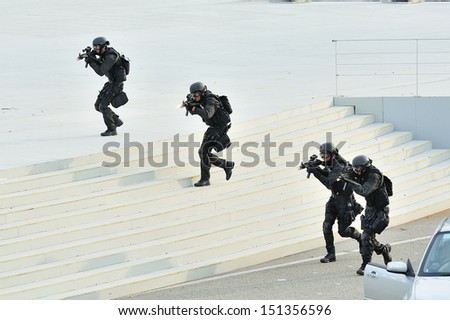 SINGAPORE - JULY 20: Singapore Police Force Special Tactics & Rescue (STAR) unit demonstrating during National Day Parade (NDP) Rehearsal 2013 on July 20, 2013 in Singapore