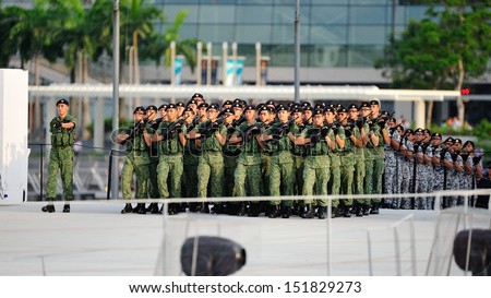 SINGAPORE - JULY 20: Contingents marching to the parade ground during National Day Parade (NDP) Rehearsal 2013 on July 20, 2013 in Singapore