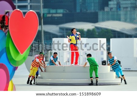 SINGAPORE - JULY 20: Event host Sebastian Tan performing during National Day Parade (NDP) Rehearsal 2013 on July 20, 2013 in Singapore