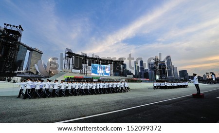 SINGAPORE - JULY 20: Republic of Singapore Air Force and Police Force guard-of-honor contingents marching during National Day Parade (NDP) Rehearsal 2013 on July 20, 2013 in Singapore