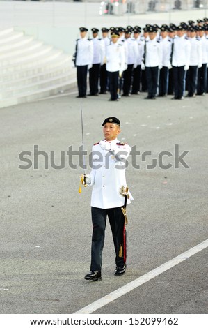 SINGAPORE - JULY 20: Parade Commander marching during National Day Parade (NDP) Rehearsal 2013 on July 20, 2013 in Singapore