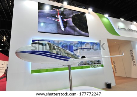 SINGAPORE - FEBRUARY 12: Commercial of Aircraft Corporation of China (COMAC) booth showcasing C919 twin jet passenger plane at Singapore Airshow February 12, 2014 in Singapore