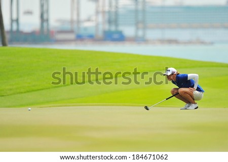 SINGAPORE - MARCH 2: Spanish player Azahara Munoz aiming at the green during HSBC Women\'s Champions at Sentosa Golf Club Serapong Course March 2, 2014 in Singapore