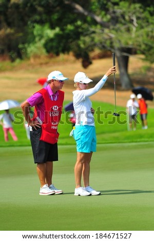 SINGAPORE - MARCH 2: Australian Karrie Webb aiming at the green during HSBC Women\'s Champions at Sentosa Golf Club Serapong Course March 2, 2014 in Singapore