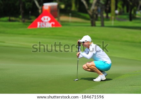 SINGAPORE - MARCH 2: Australian Karrie Webb aiming on the green during HSBC Women\'s Champions at Sentosa Golf Club Serapong Course March 2, 2014 in Singapore