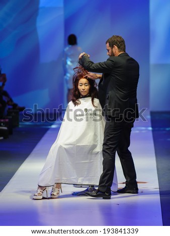 Singapore - May 15: Model showcasing hair style collection by Schwarzkopf Professional at Audi Fashion Festival 2014 on May 15, 2014 in Singapore