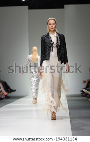 Singapore - May 16: Model showcasing fall/winter designs from Farah Khan at Audi Fashion Festival 2014 on May 16, 2014 in Singapore