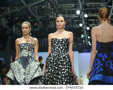 Singapore - May 18: Models showcasing fall collection from Oscar de la Renta at Audi Fashion Festival 2014 on May 18, 2014 in Singapore