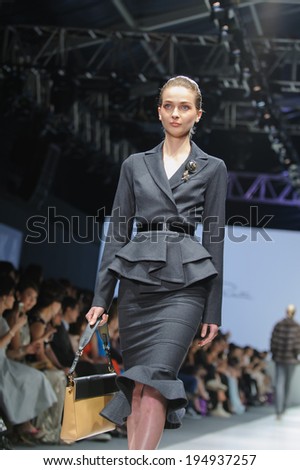 Singapore - May 18: Model showcasing fall collection from Oscar de la Renta at Audi Fashion Festival 2014 on May 18, 2014 in Singapore