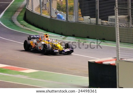 SINGAPORE - SEPTEMBER 26: Nelsinho Piquet entering pit lane in his Renault during first Formula One night race September 26, 2008 in Singapore