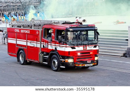 SINGAPORE - AUGUST 09: Showcasing of fire engine\'s capabilities during Singapore National Day Parade 2009 August 09, 2009 in Singapore