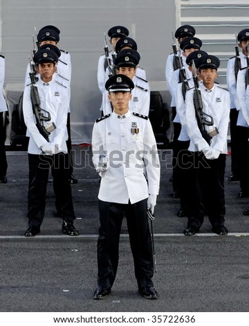 SINGAPORE - AUGUST 09: Police guard-of-honor contingent at attention during Singapore National Day Parade 2009 August 09, 2009 in Singapore