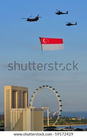 SINGAPORE - AUGUST 09: Fly past of Singapore flag during Singapore National Day Parade 2010 at the Padang August 09, 2010 in Singapore