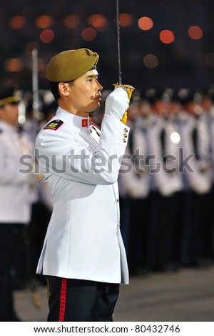 SINGAPORE - JUNE 25: Parade Commander saluting the President during National Day Parade Singapore 2011 Combined Rehearsal on June 25, 2011 in Singapore.