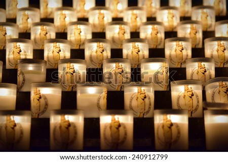 PARIS - SEPTEMBER 24: Candles burning in the famous Notre Dame de Paris cathedral, taken on September 24, 2014 in Paris, France