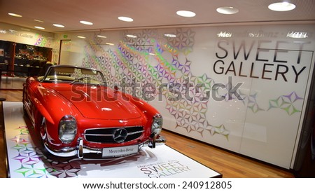 PARIS - SEPTEMBER 24: Red classic 300 SL on display at the Mercedes Benz gallery along Champ Elysees, taken on September 24, 2014 in Paris, France