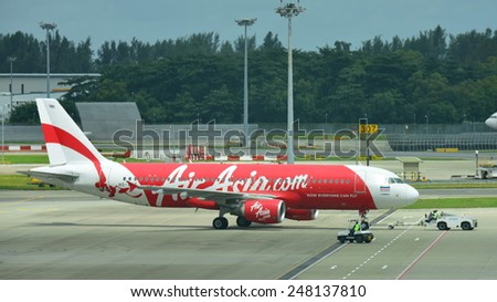 SINGAPORE - JANUARY 10: Thai AirAsia Airbus 320 ready for push back at Changi Airport on January 10, 2015 in Singapore
