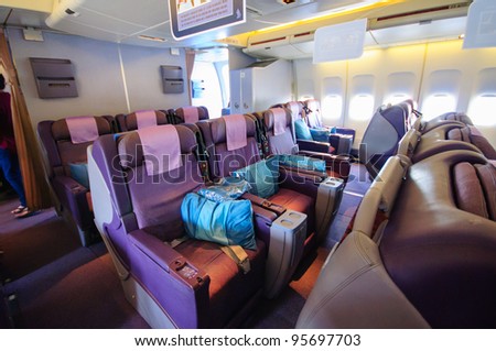SINGAPORE - FEBRUARY 12: Business class seats in Singapore Airlines\' (SIA) last Boeing 747-400 aircraft at Singapore Airshow February 12, 2012 in Singapore