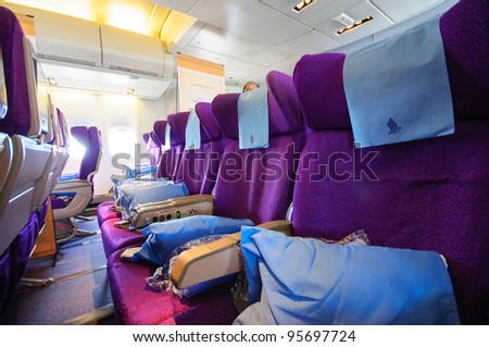 SINGAPORE - FEBRUARY 12: Economy class cabin in Singapore Airlines\' (SIA) last Boeing 747-400 aircraft at Singapore Airshow February 12, 2012 in Singapore