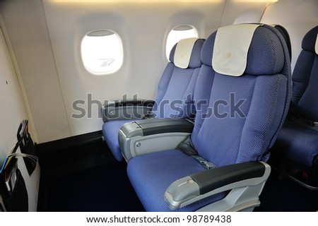 SINGAPORE - FEBRUARY 17: Business class cabin of a China Southern Airlines Embraer 190 aircraft at Singapore Airshow February 17, 2012 in Singapore