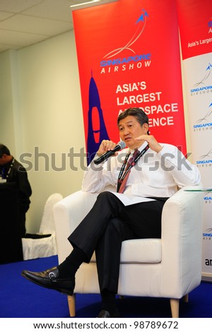 SINGAPORE - FEBRUARY 17: Mr Jimmy Lau, Managing Director of Experia Events speaking at the wrap-up media briefing at Singapore Airshow February 17, 2012 in Singapore