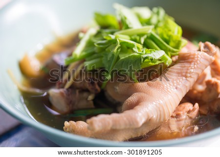 Thai-style braised chicken feet with pepper and ginger soup, soft background