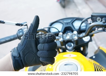Human hand in a Motorcycle Racing Gloves Ready to ride