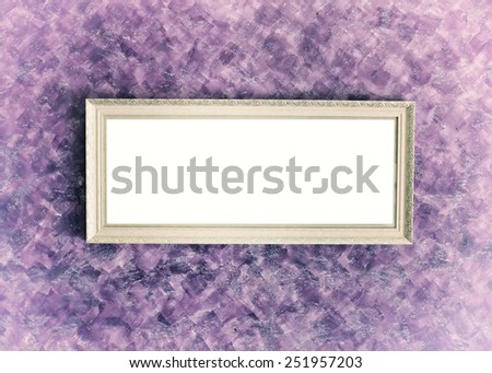old antique white frame over beautiful purple wall background
